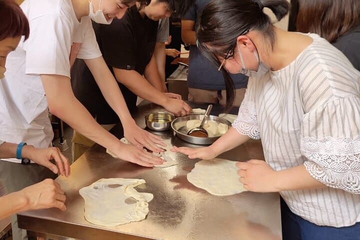 Japanese Student having fun with roti Canai Dough